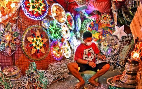 Filipino parol maker at work during the 13th month pay season